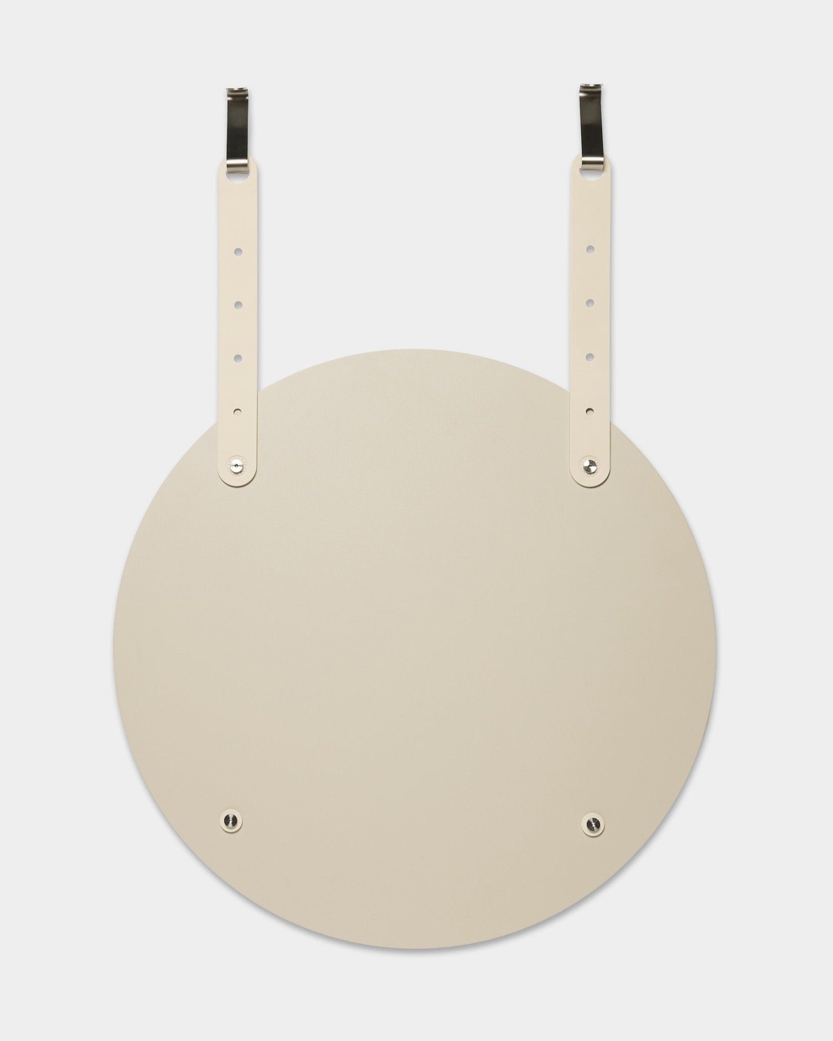 The Vala | Mirror / BM1 by WoodUpp is a round, beige wall mirror with adjustable leather straps for hanging; installation requires no wall drilling.