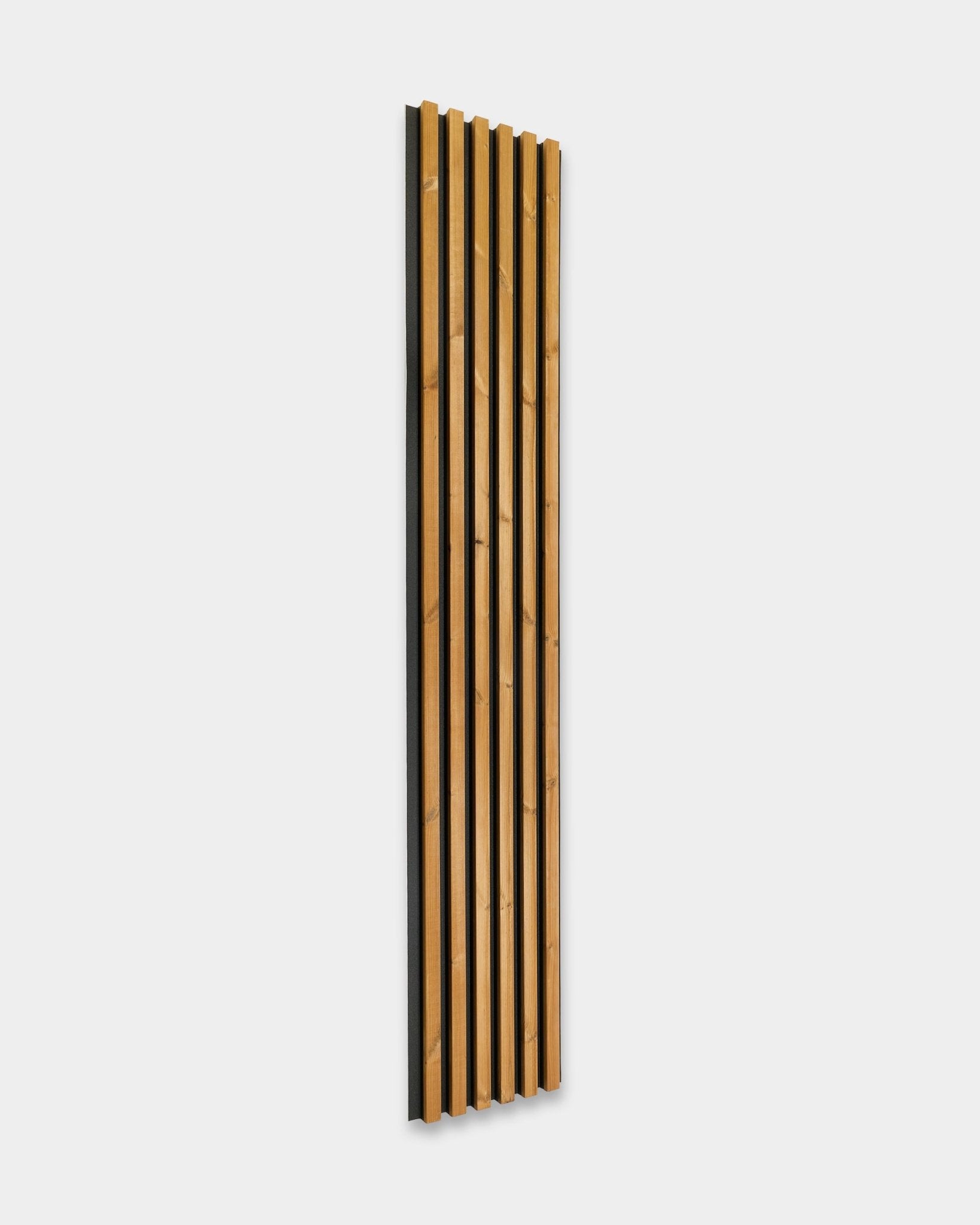 WoodUpp Aluwood facade panel in brown, size 240 x 45.1 cm, featuring vertical Nordic spruce slats and black backing, installed on a white surface.